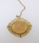 A QEII gold sovereign set within a pendant necklace.