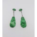 A pair of jade pendant earrings.