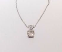 A diamond pendant with Zam Gem diamond report, indicating natural round brilliant cut diamond 0.