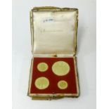 A set of four Sir Winston Churchill commemorative medals set in 18ct gold, by Metal Import Ltd