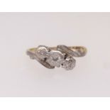 An 18ct antique diamond three stone ring, finger size K.