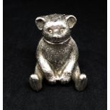 An Edwardian silver teddy bear pepperette, HW Ltd, height 40mm.