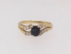 An 18ct sapphire and diamond set ring, finger size K.