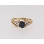 An 18ct sapphire and diamond set ring, finger size K.
