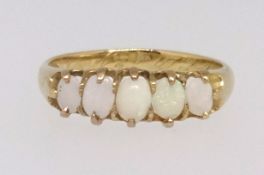 A Victorian five stone opal ring set in yellow gold with inscription and dated 1868, finger size