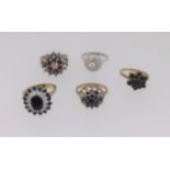 An 18ct cluster set dress ring together with four other 9ct gold dress rings (5) total weight