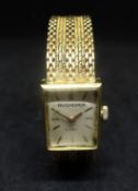 Bucherer, a ladies 18ct gold square wristwatch with 18ct gold bracelet with purchase receipt from