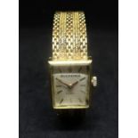 Bucherer, a ladies 18ct gold square wristwatch with 18ct gold bracelet with purchase receipt from