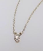 A 9ct yellow gold pendant necklace with chain set with a single diamond.