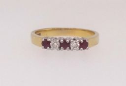 A 18ct ruby and diamond five stone ring, finger size P.
