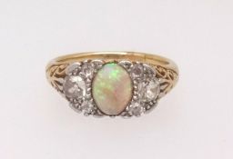 An 18ct antique opal and diamond set ring, finger size R.