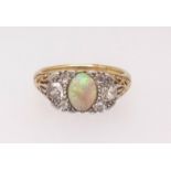 An 18ct antique opal and diamond set ring, finger size R.