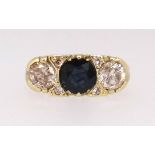 A Victorian style 18ct sapphire and diamond ring, the sapphire 5.8mm round, two diamonds approx. 0.