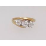 An 18ct diamond three stone ring in yellow gold set with three round brilliant cut diamonds, total