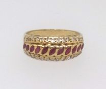 An 18ct dress ring set with three rows of diamonds and ruby effect gem stones approx. 3.9gms, finger