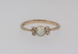 A 9ct opal and diamond set dress ring, finger size N.