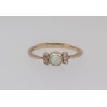 A 9ct opal and diamond set dress ring, finger size N.