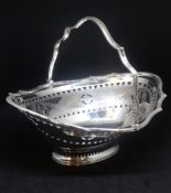 Edward VII silver oval handled basket with ribbon and scallop boarder, pierced and chased