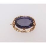 A Russian gold brooch set with amethyst coloured stone, marked '583' and other markings, width
