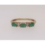 A silver gilt and greenstone dress ring, finger size P.