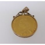 A Victoria 1887 two pound gold coin mounted as a pendant, total weight 19.2gms.