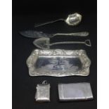 A mixed lot of silver including silver pin tray with embossed winged cherub decoration 15cm long,