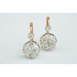 A beautiful pair of period cushion shaped old cut 2.50ct diamond ear studs with hook/wire fitting,