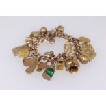 A 9ct gold charm bracelet approx. 43gms.