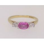 An 18ct pink sapphire and diamond ring, finger size L.