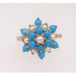 A 9ct turquoise and pearl cluster ring, finger size P.