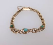 A 15ct turquoise and pearl set bracelet, approx 13.8gms.