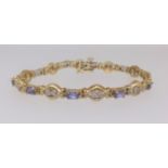 A 14ct modern tanzanite and gem stone bracelet approx. 13.3gms.