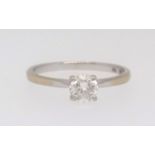 An 18ct white gold diamond solitaire ring, stamped 750 set with a round brilliant cut white