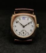 A vintage 9ct gold cushion cased wristwatch, the white dial with arabic numerals (blue 12), sub-