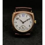 A vintage 9ct gold cushion cased wristwatch, the white dial with arabic numerals (blue 12), sub-