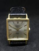 Rolex, an 18ct gold square cased Cellini ladies wristwatch, silvered baton dial, model No.3659, with