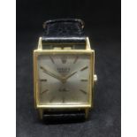 Rolex, an 18ct gold square cased Cellini ladies wristwatch, silvered baton dial, model No.3659, with