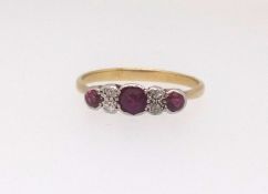 A ruby and diamond dress ring set in yellow gold unmarked, finger size P.