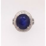 A 14ct white gold and diamond ring set with an oval cut blue gem stone approx. 6.5ct diamond