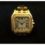 LADIES CARTIER PANTHERE DIAMOND SET EIGHTEEN CARAT GOLD WRISTWATCH the silver dial set with Roman