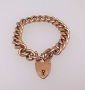 A 9ct gold curb link bracelet with padlock clasp, 24.4gms.
