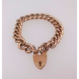 A 9ct gold curb link bracelet with padlock clasp, 24.4gms.