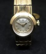 Omega, ladies 9ct yellow gold wristwatch with integral bracelet, with original box, outer box,