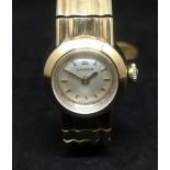 Omega, ladies 9ct yellow gold wristwatch with integral bracelet, with original box, outer box,