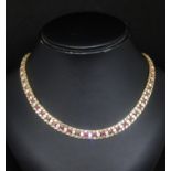 A 14ct yellow gold fancy bracelet set with ruby and cubic zirconia stones together with a matching