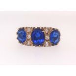 A 9ct bluestone and diamond set ring, finger size P.