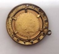A modern half sovereign pendant dated 2000.