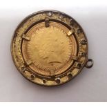 A modern half sovereign pendant dated 2000.