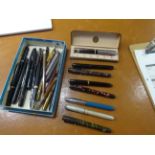 A collection of various fountain pens including Parker pens with 14k nibs etc.