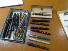 A collection of various fountain pens including Parker pens with 14k nibs etc.